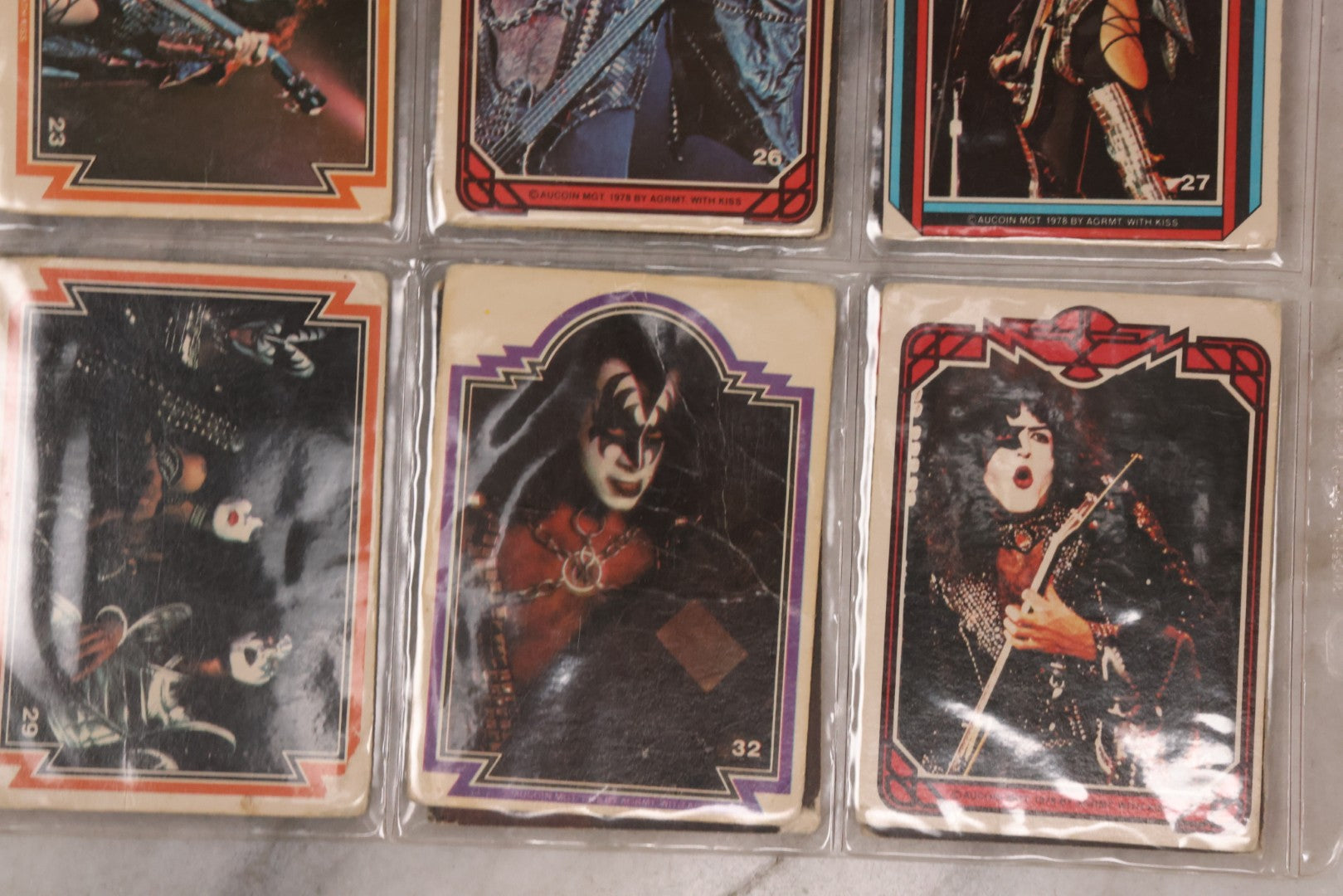 Lot 169 - Vintage Ephemera Grouping Including 18 Collectible Kiss Trading Cards, D.C. Gang Busters Comic No. 58, And Three Stooges Promo Photo