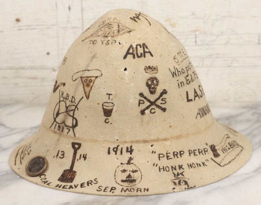 Lot 001 - Antique Folk Art Felt Cloche Hat From Vermont Academy, Circa 1910-1920, With Burned-In Decorations And Signatures From Students, Including Halloween Pumpkin, Skull And Crossbones, Pipe, Rifle, Playing Cards, Other Motifs, Tintype Button