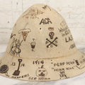 Lot 001 - Antique Folk Art Felt Cloche Hat From Vermont Academy, Circa 1910-1920, With Burned-In Decorations And Signatures From Students, Including Halloween Pumpkin, Skull And Crossbones, Pipe, Rifle, Playing Cards, Other Motifs, Tintype Button