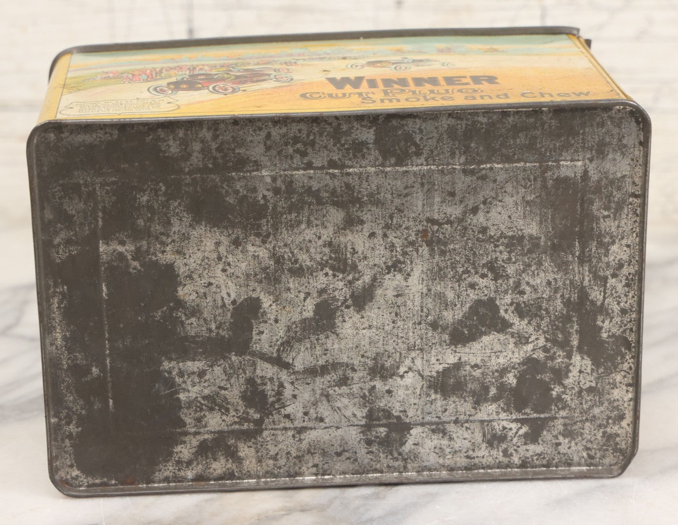 Lot 002 - Antique Tin Lithograph "Winner Cut Plug Smoke And Chew" Tobacco Tin With Auto Racing Motif, J. Wright Co., Richmond, Virginia, Circa 1910-1920, Note Missing Handle