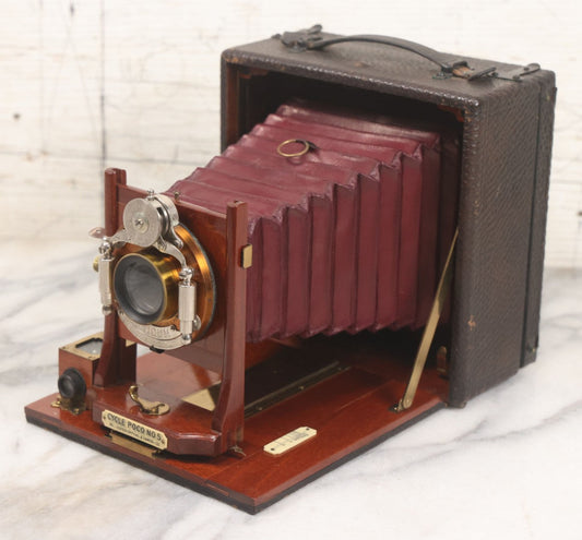 Lot 003 - Antique Cycle Poco No. 5 Folding Camera By Rochester Optical & Camera Co. With Bausch & Lomb Unicum Lens, With Three Matching Plate Holders And Original Case, Circa 1890s