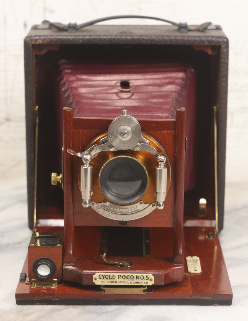 Lot 003 - Antique Cycle Poco No. 5 Folding Camera By Rochester Optical & Camera Co. With Bausch & Lomb Unicum Lens, With Three Matching Plate Holders And Original Case, Circa 1890s