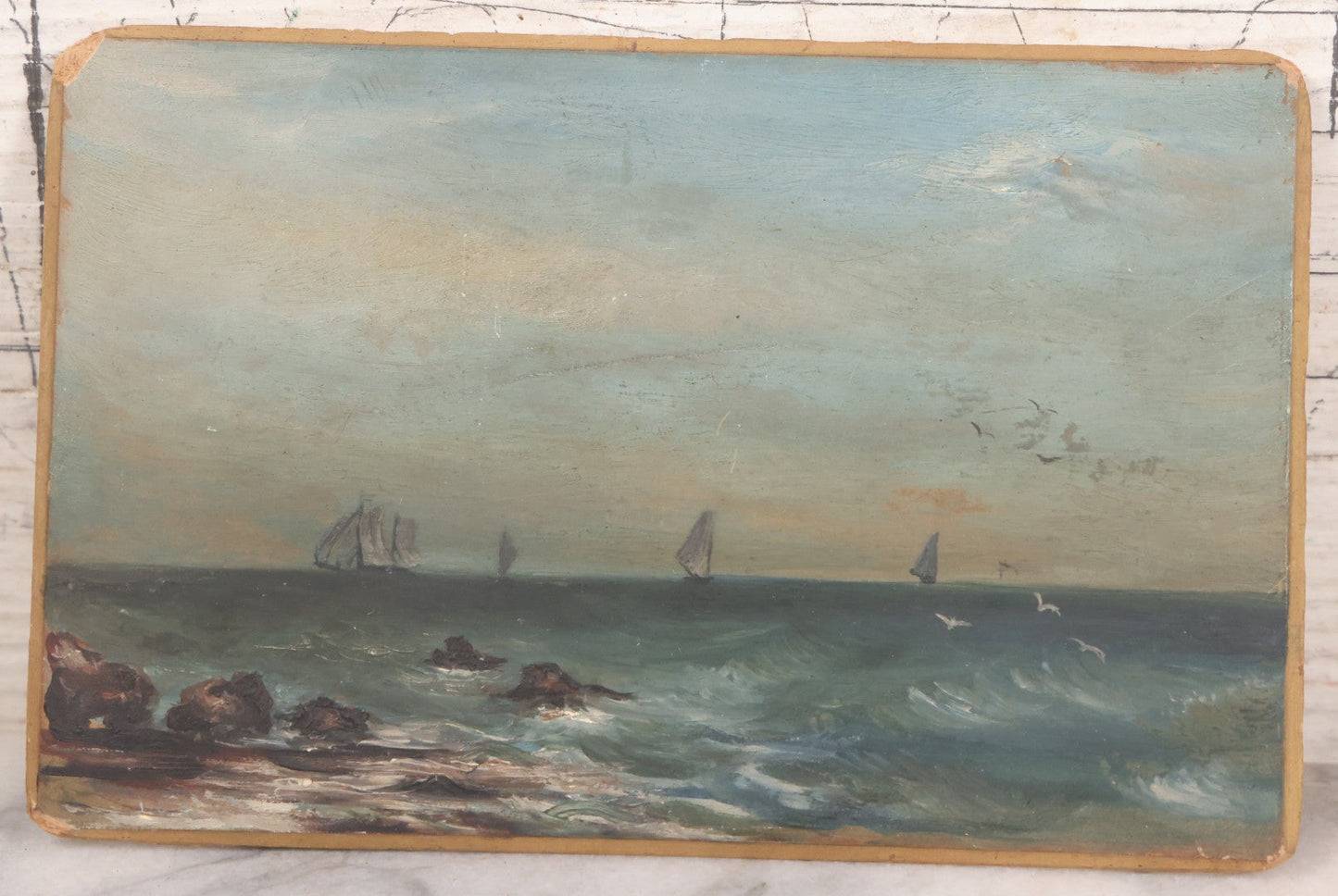Lot 014 - Antique Miniature Oil On Board Seascape Painting With Sailboats Off The Cost, Rocky Shore, Seagulls In Flight, On Beveled Artists Board, Circa Mid 19th Century, 6-1/2" x 4-1/4"