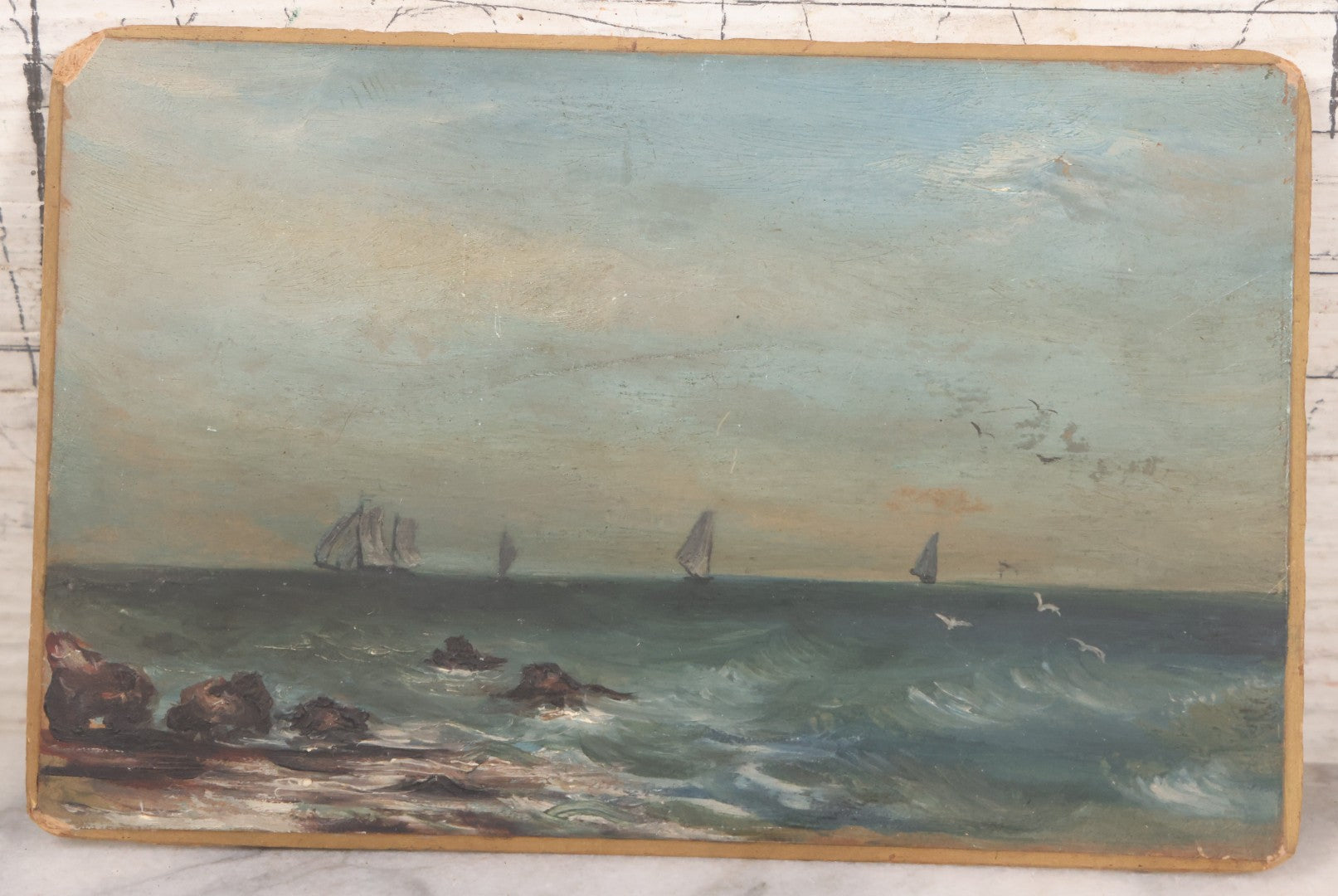 Lot 014 - Antique Miniature Oil On Board Seascape Painting With Sailboats Off The Cost, Rocky Shore, Seagulls In Flight, On Beveled Artists Board, Circa Mid 19th Century, 6-1/2" x 4-1/4"