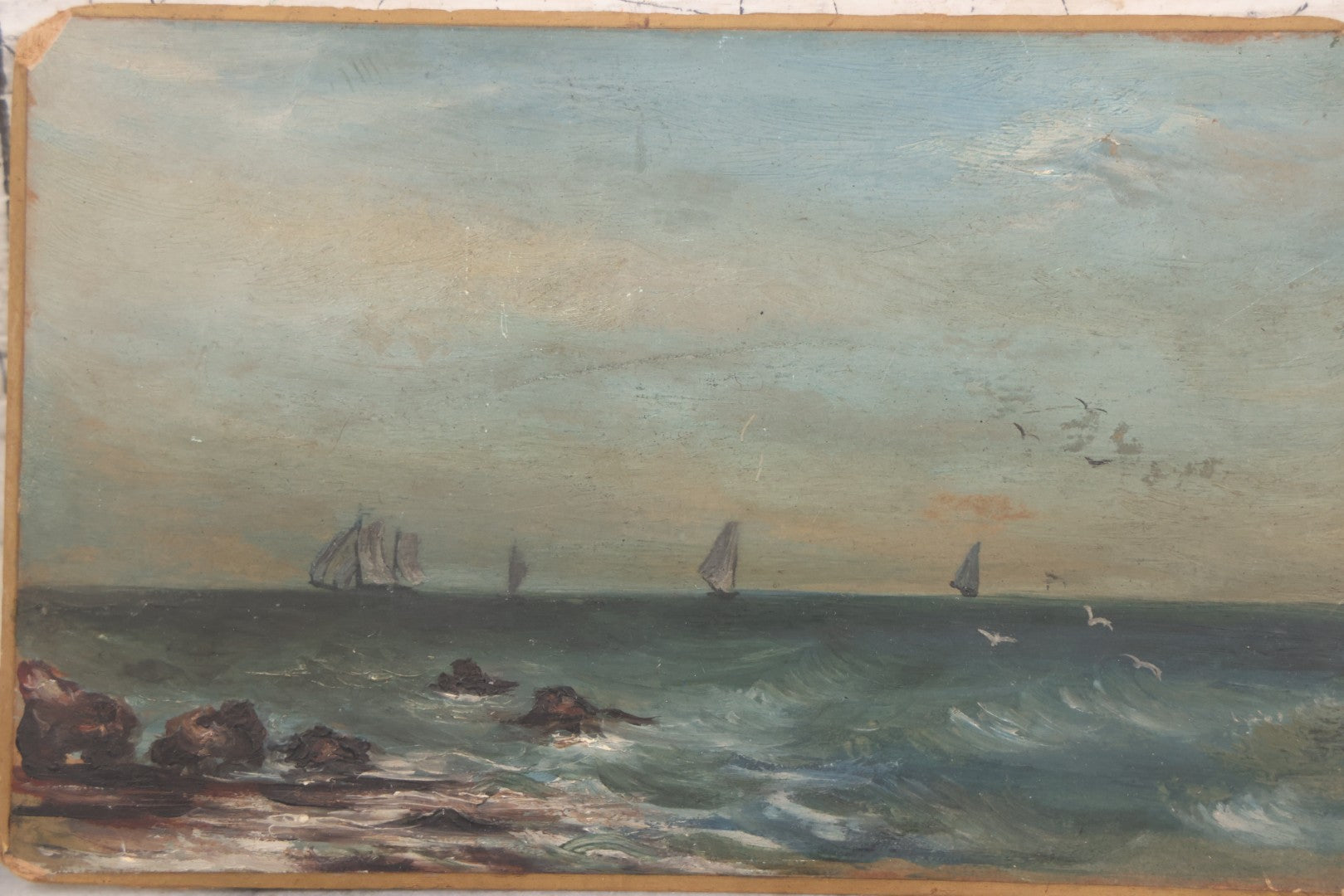 Lot 014 - Antique Miniature Oil On Board Seascape Painting With Sailboats Off The Cost, Rocky Shore, Seagulls In Flight, On Beveled Artists Board, Circa Mid 19th Century, 6-1/2" x 4-1/4"