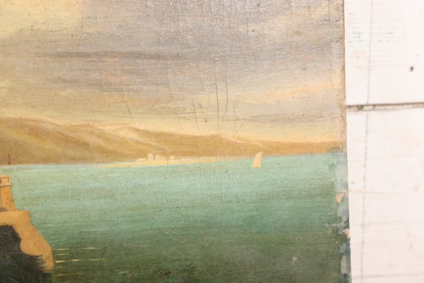 Lot 015 - Antique European Oil On Canvas Painting Landscape Scene Depicting Seaside Castle With Maidens Looking Toward The Coast From Stone Ruins, Mountains And Sailboats In The Distance, Cloudy Sky, Circa Early 19th Century, 24" x 18"