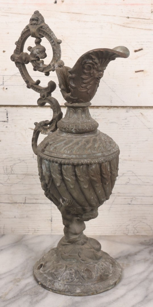Lot 020 - Antique Spelter White Metal Gothic Style Ewer With Green Man Motif, Figural Child Base, Former Lamp Conversion, 14-1/2" Height