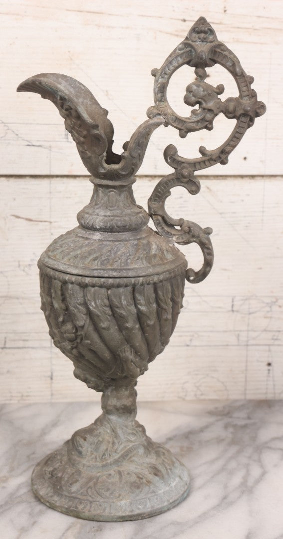 Lot 020 - Antique Spelter White Metal Gothic Style Ewer With Green Man Motif, Figural Child Base, Former Lamp Conversion, 14-1/2" Height