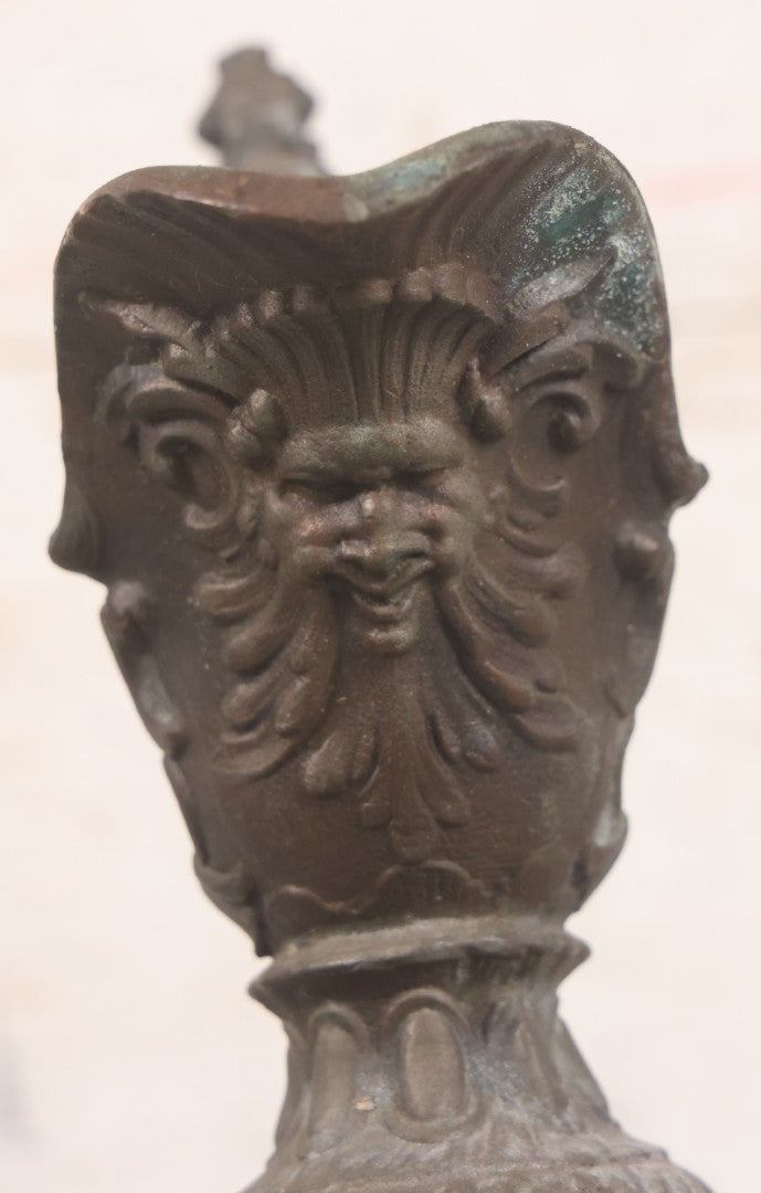 Lot 020 - Antique Spelter White Metal Gothic Style Ewer With Green Man Motif, Figural Child Base, Former Lamp Conversion, 14-1/2" Height