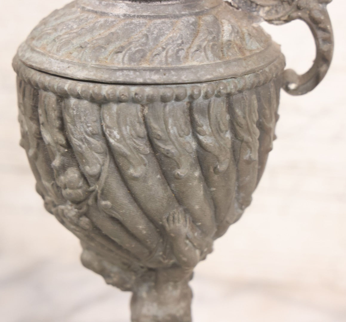 Lot 020 - Antique Spelter White Metal Gothic Style Ewer With Green Man Motif, Figural Child Base, Former Lamp Conversion, 14-1/2" Height