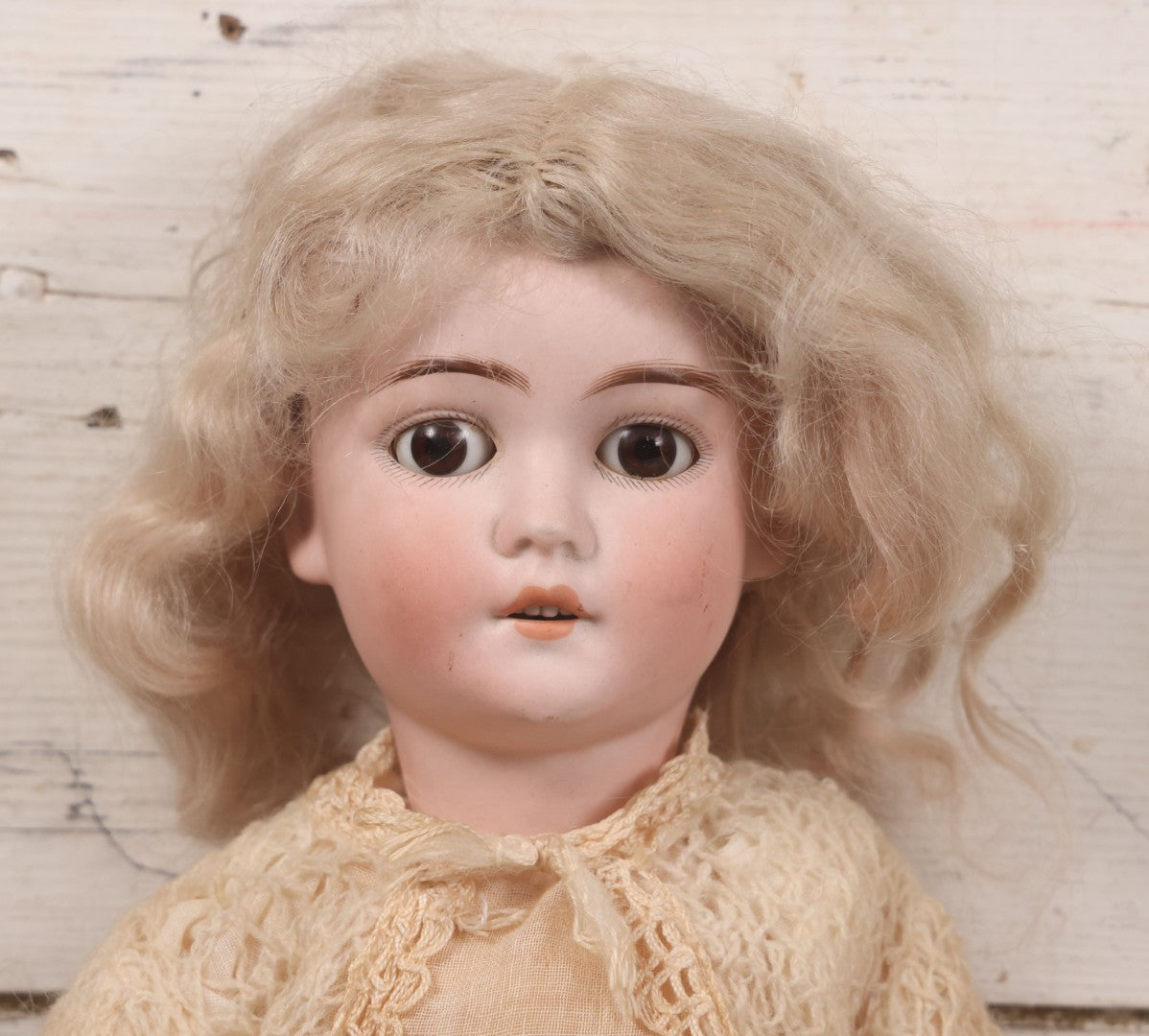 Lot 022 - Antique German Bisque Head Doll By Adolf Wislizenus, Marked "A.W. Special," Made In Germany, With Composition Body, Blonde Wig, And Clothing, Circa 1900, 24" Height