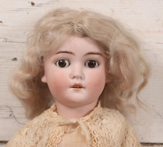 Lot 022 - Antique German Bisque Head Doll By Adolf Wislizenus, Marked "A.W. Special," Made In Germany, With Composition Body, Blonde Wig, And Clothing, Circa 1900, 24" Height