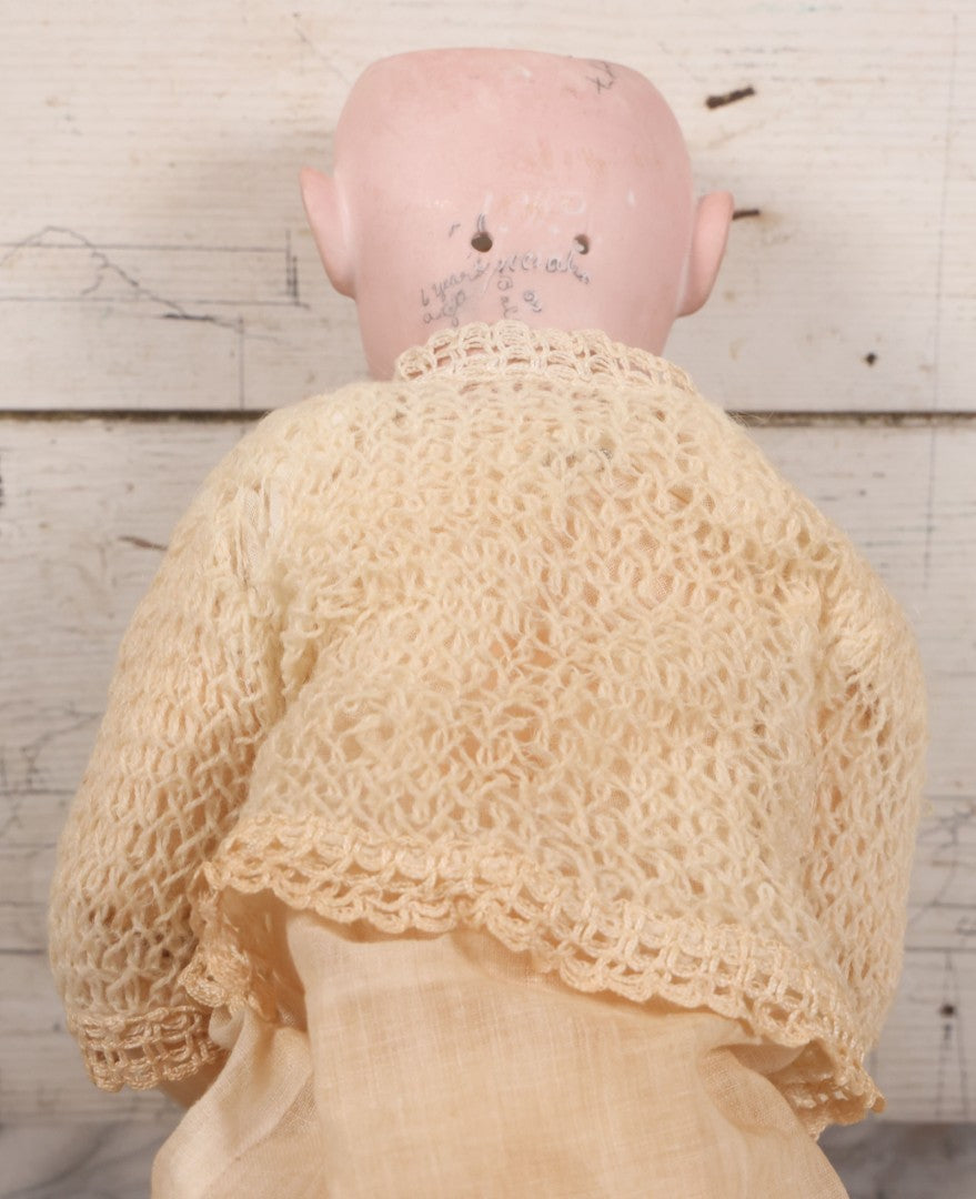 Lot 022 - Antique German Bisque Head Doll By Adolf Wislizenus, Marked "A.W. Special," Made In Germany, With Composition Body, Blonde Wig, And Clothing, Circa 1900, 24" Height