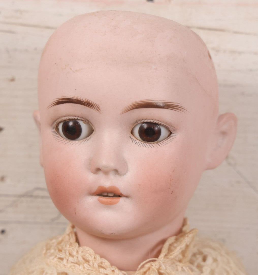 Lot 022 - Antique German Bisque Head Doll By Adolf Wislizenus, Marked "A.W. Special," Made In Germany, With Composition Body, Blonde Wig, And Clothing, Circa 1900, 24" Height