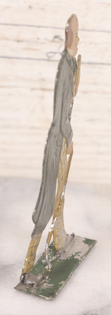 Lot 034 - Single Antique German Zinnfiguren Flat Pewter Figure Of Scholarly Man In Checkered Pants, Hat, And Cane, Hand Painted