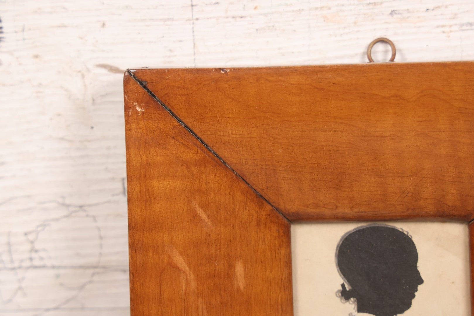 Lot 046 - Antique Folk Art Hand Cut Fabric Silhouette Of Young Girl With Added Pencil Details In Wide Tiger Maple Frame, 6-7/8" x 7-3/8"