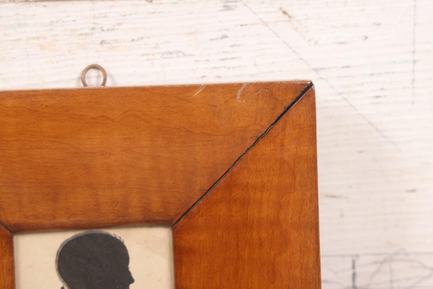 Lot 046 - Antique Folk Art Hand Cut Fabric Silhouette Of Young Girl With Added Pencil Details In Wide Tiger Maple Frame, 6-7/8" x 7-3/8"