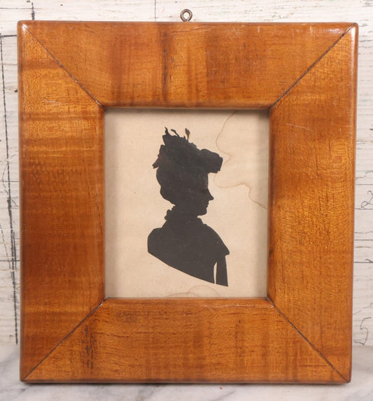Lot 047 - Antique Folk Art Hand Cut Paper Silhouette Of Woman In Wide Tiger Maple Frame, Note Water Damage, 7-1/2" x 8"