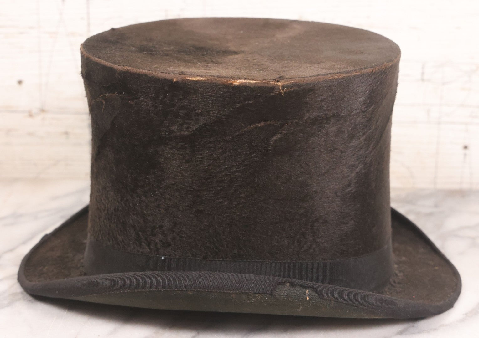 Lot 049 - Antique Beaverskin Stove Pipe Top Hat Manufactured By Alfred Matthews, St. Louis, Missouri, With Dark Mustard Painted Tin Hat Box With Blue-Green Interior