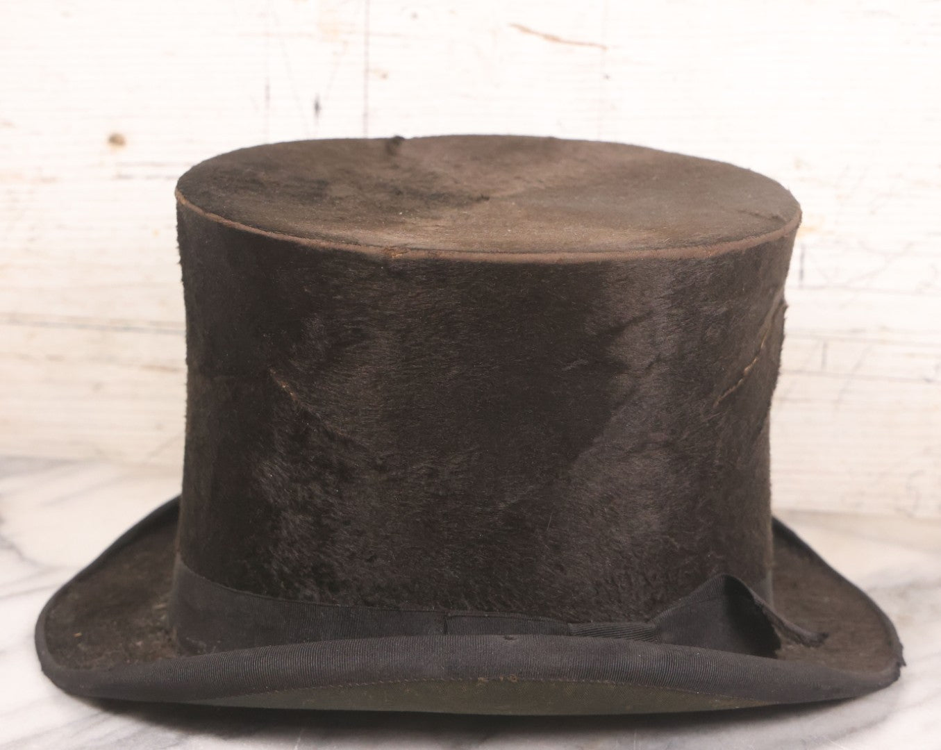 Lot 049 - Antique Beaverskin Stove Pipe Top Hat Manufactured By Alfred Matthews, St. Louis, Missouri, With Dark Mustard Painted Tin Hat Box With Blue-Green Interior