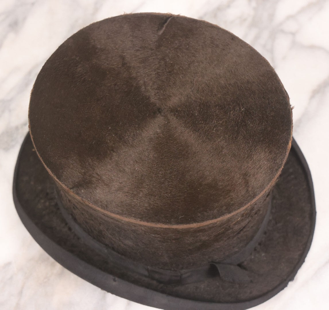 Lot 049 - Antique Beaverskin Stove Pipe Top Hat Manufactured By Alfred Matthews, St. Louis, Missouri, With Dark Mustard Painted Tin Hat Box With Blue-Green Interior