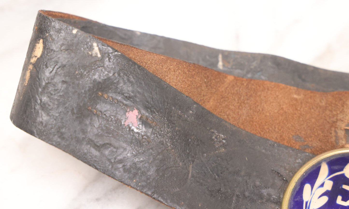 Lot 053 - Antique Leather Belt With Unusual Reverse Painted Glass Enamel Roundel With Laurel Motif, Mirrored Lettering, Unknown Fraternal Order, Circa Late 19th Century