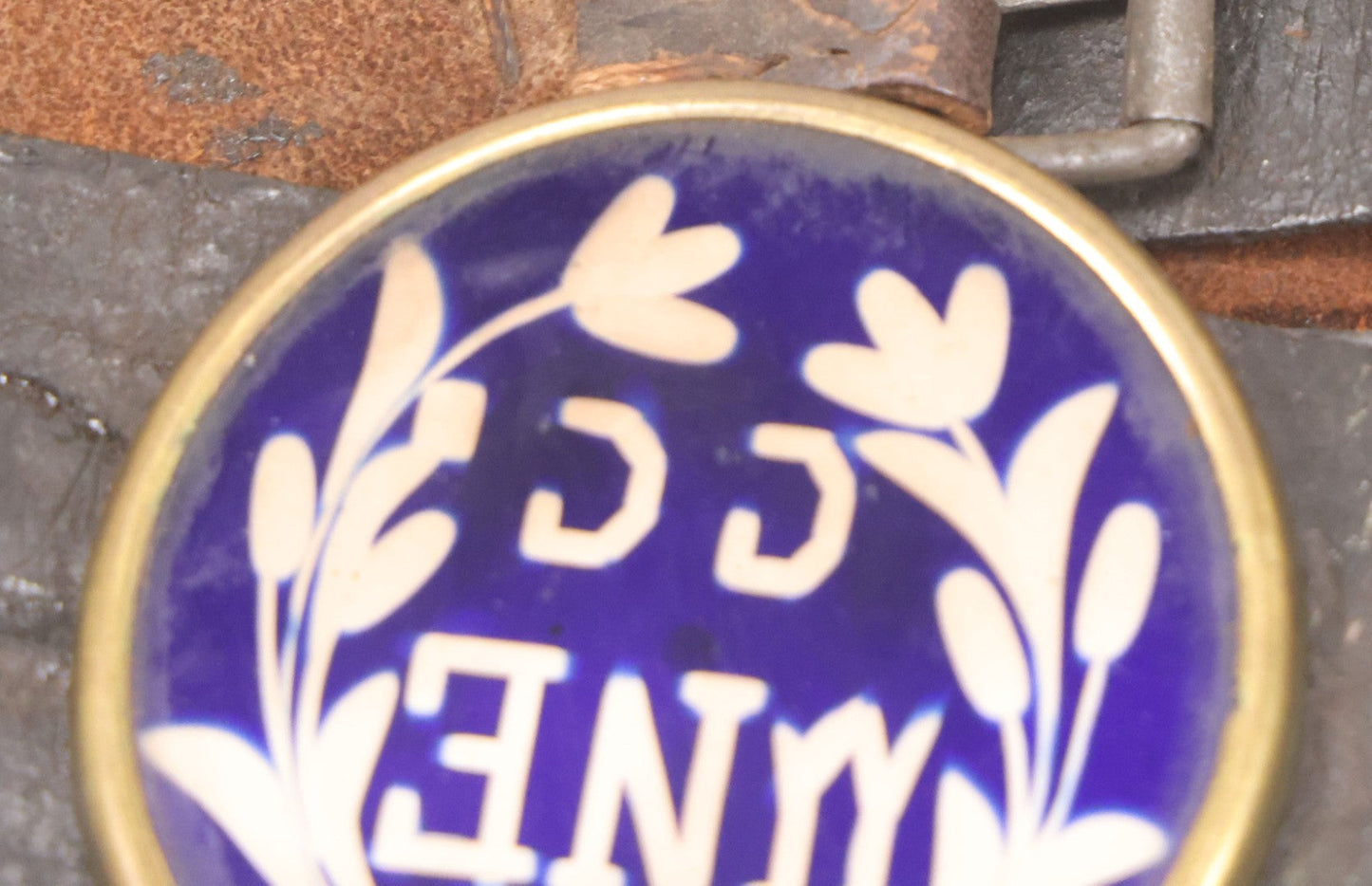 Lot 053 - Antique Leather Belt With Unusual Reverse Painted Glass Enamel Roundel With Laurel Motif, Mirrored Lettering, Unknown Fraternal Order, Circa Late 19th Century