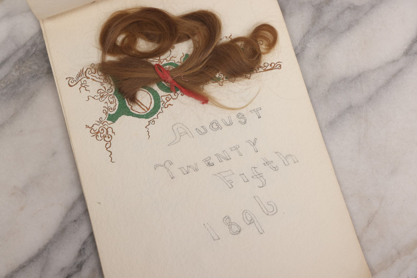 Lot 056 - Antique Original Handwritten Calligraphy Baby Book For Baby Born August 25th, 1896, Including A Lock Of Baby's Hair, Other Biographical Details