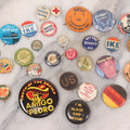 Lot 061 - Grouping Of Approximately 30 Vintage And Antique Pinback Buttons Including "Black And Proud," "No Third Term," "Garden Patch Club," "Ike," "Corey Hart," And More