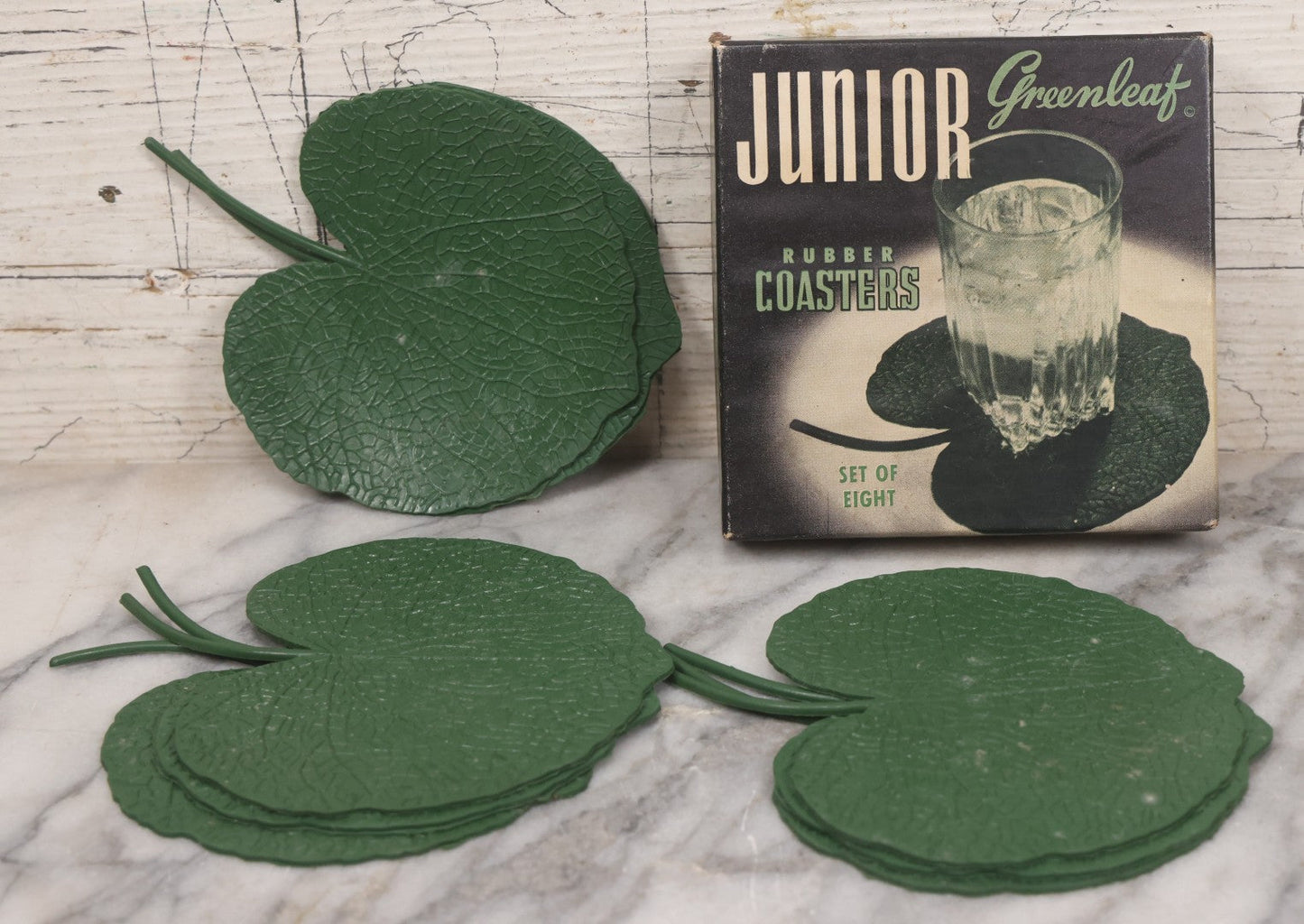 Lot 065 - Vintage Boxed Set Of Eight Junior Greenleaf Rubber Coasters, Lily Pad Shaped Coasters, Manufactured By John P. Gleason, Los Angeles, California, Circa 1940s