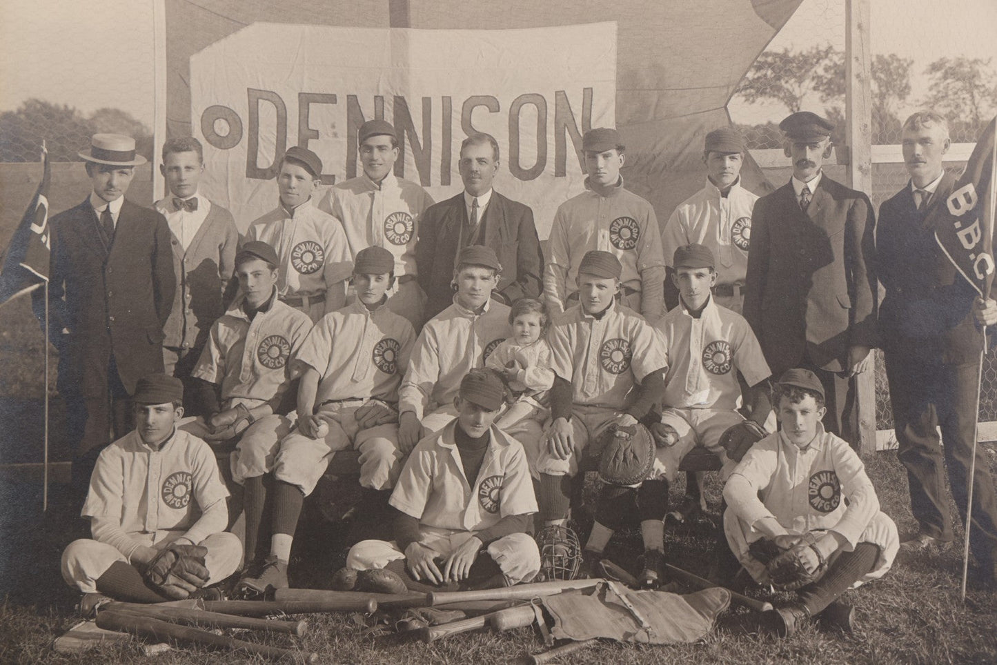 Lot 068 - Antique Boarded Photograph Of The Dennison Manufacturing Co. Baseball Team, Posing With Dennison Banner, Equipment, Circa 1915, Framingham, Massachusetts