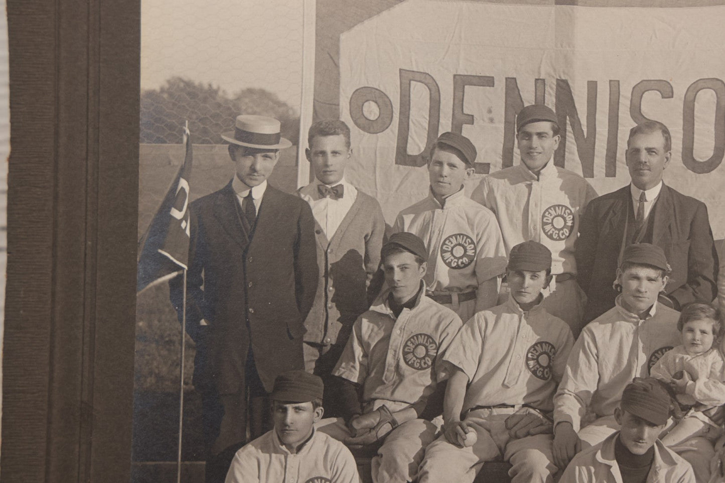 Lot 068 - Antique Boarded Photograph Of The Dennison Manufacturing Co. Baseball Team, Posing With Dennison Banner, Equipment, Circa 1915, Framingham, Massachusetts