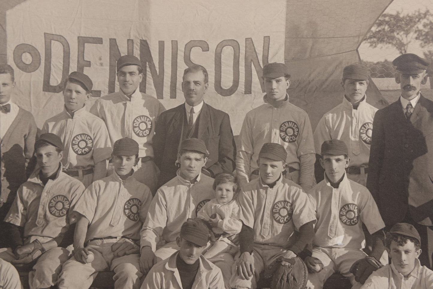 Lot 068 - Antique Boarded Photograph Of The Dennison Manufacturing Co. Baseball Team, Posing With Dennison Banner, Equipment, Circa 1915, Framingham, Massachusetts