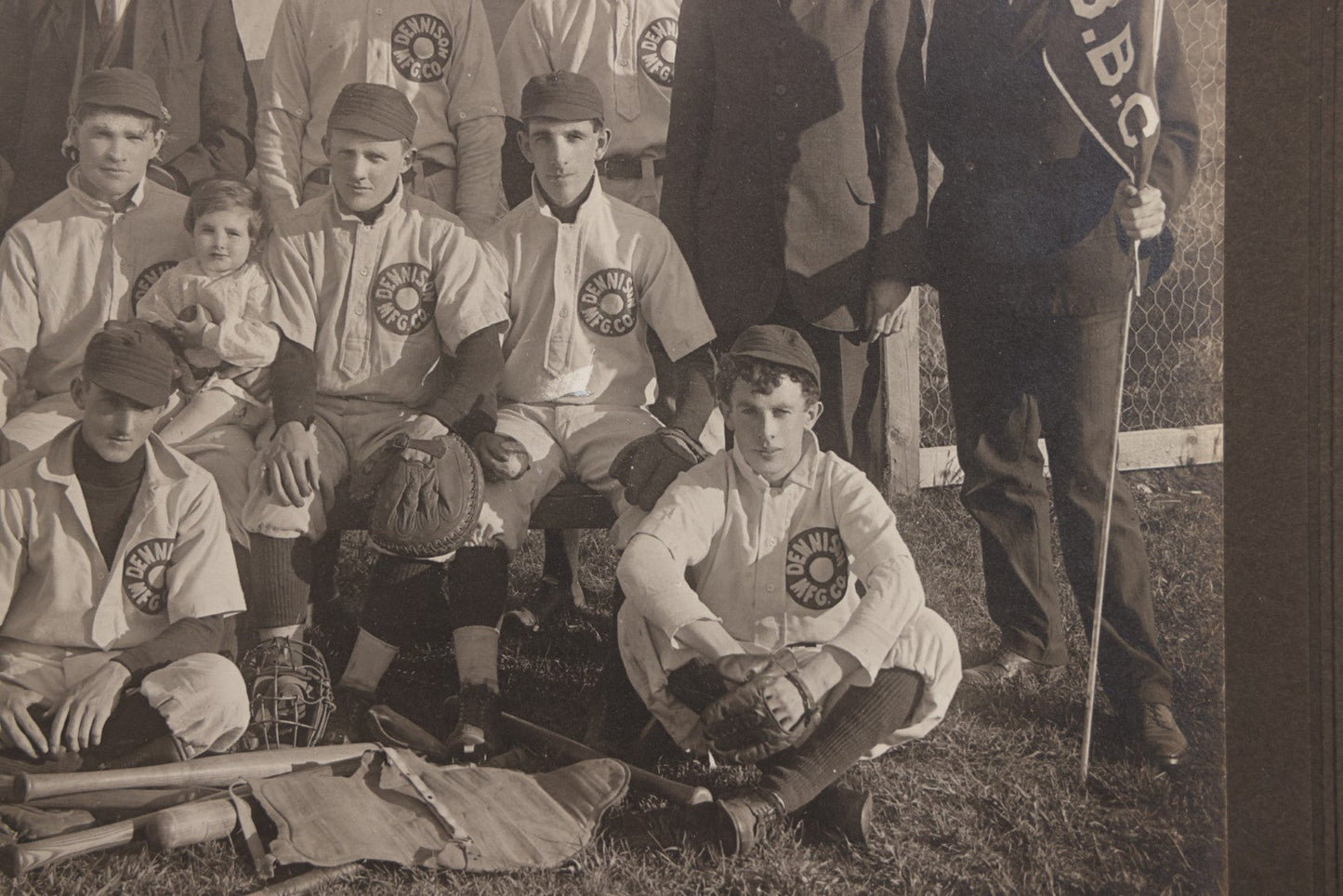 Lot 068 - Antique Boarded Photograph Of The Dennison Manufacturing Co. Baseball Team, Posing With Dennison Banner, Equipment, Circa 1915, Framingham, Massachusetts