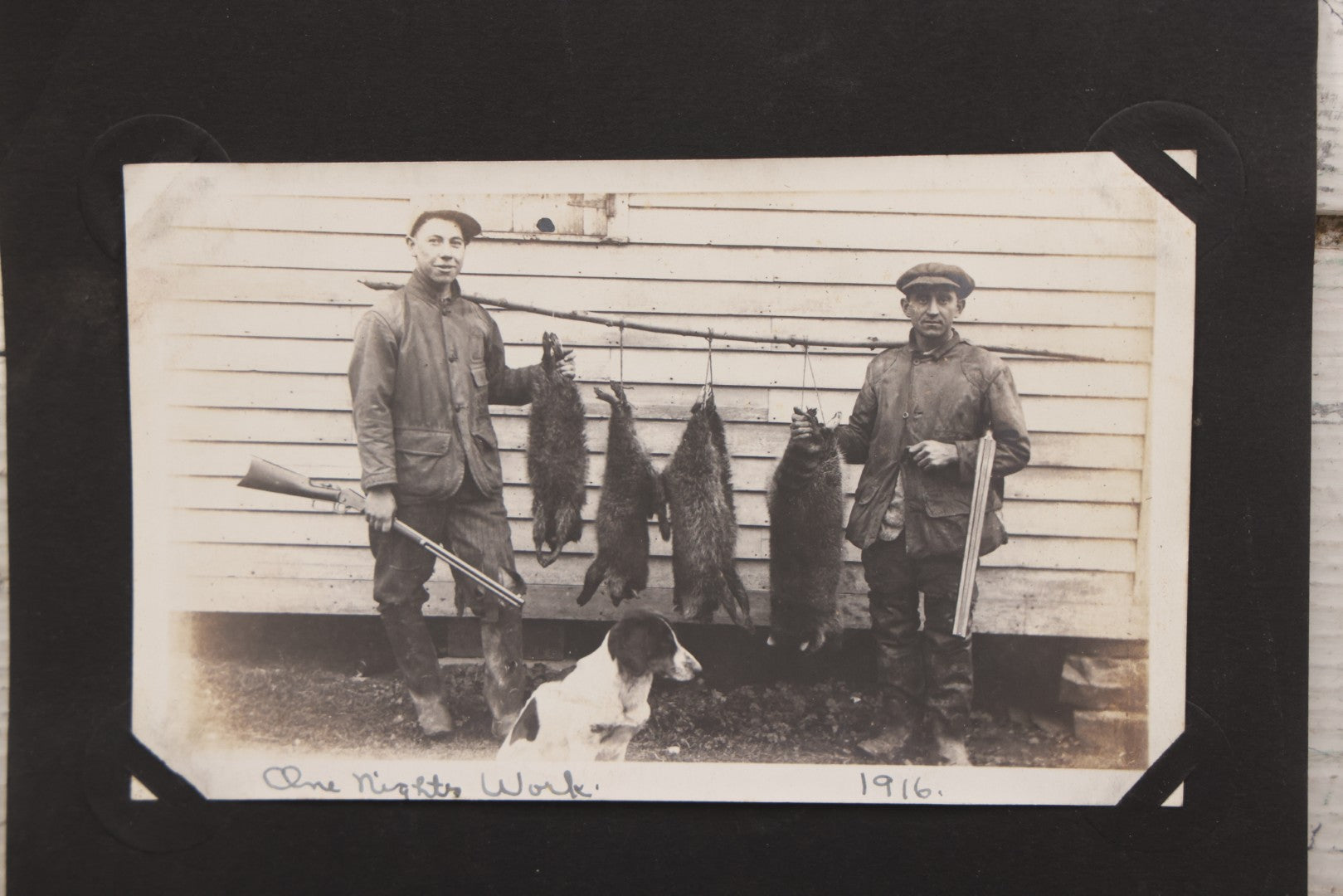 Lot 071 - Pair Of Antique Snapshot Photographs Of Hunters / Trappers And Their Dog, With Photos Of "One Night's Work" And "Half Of The Catch," 1916