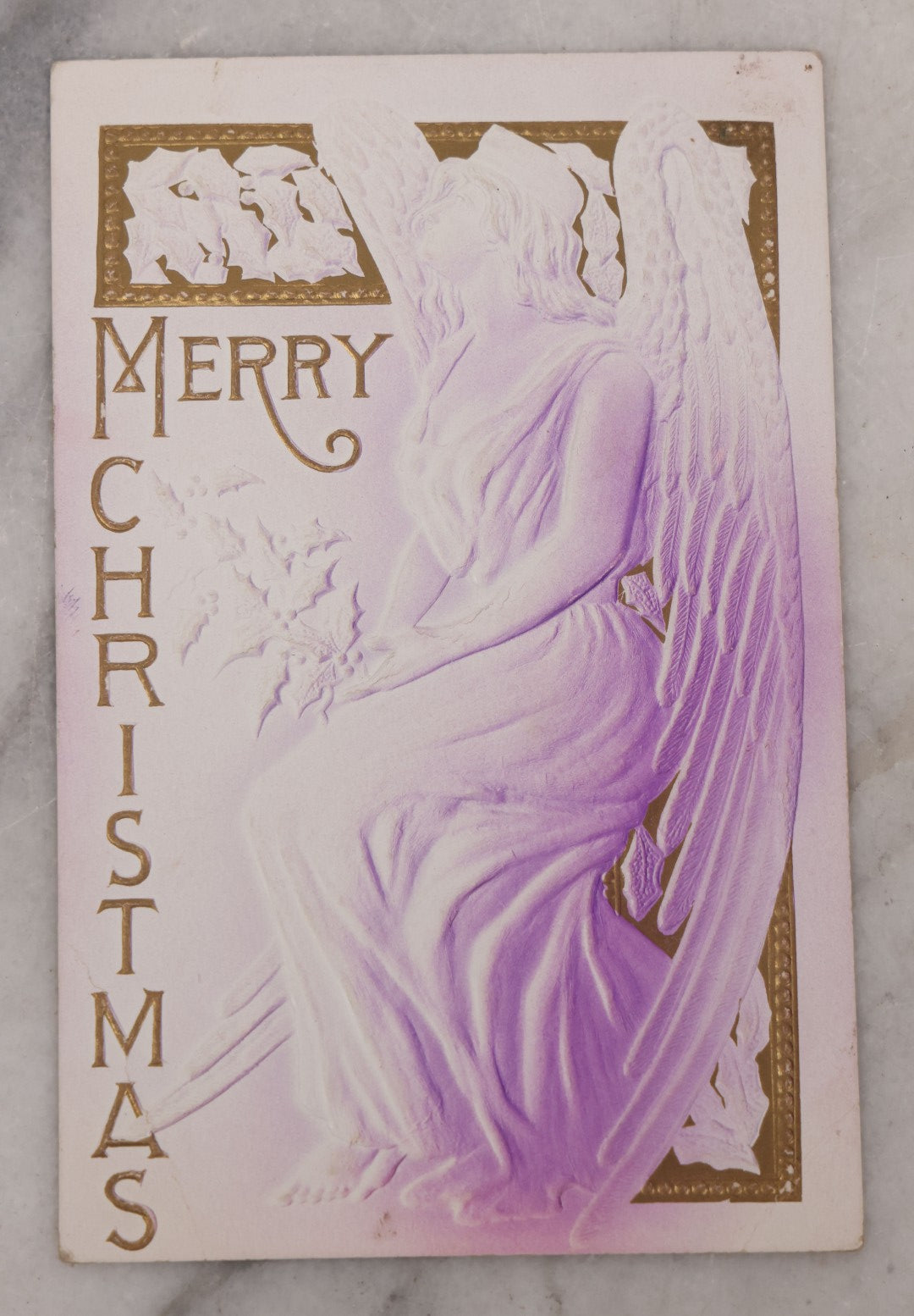 Lot 095 - Antique Embossed Christmas Postcard, "Merry Christmas" Featuring Angel And Mistletoe, White, Purple And Gold Coloring, Postmarked 1909
