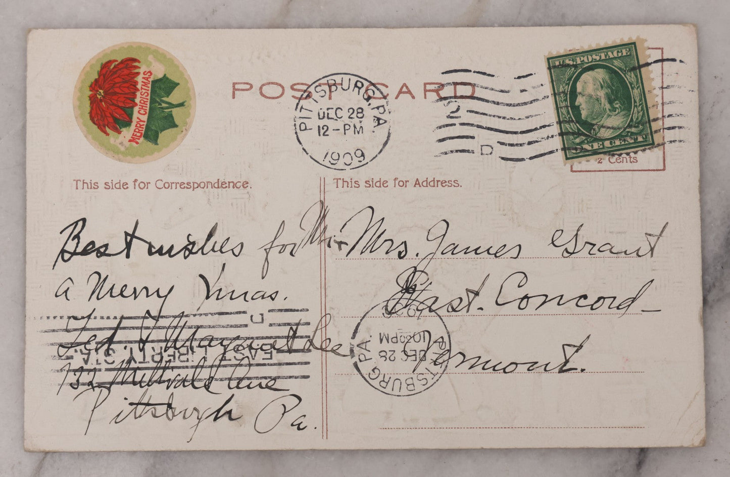 Lot 096 - Antique Embossed Christmas Postcard, "A Merry X'Mas" With Silver Coloring, Featuring Caroling Children, Toys, And Christmas Tree, With Embossed Christmas Seal Sticker On Verso, Postmarked 1909