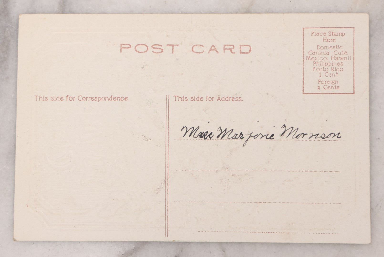 Lot 097 - Antique Embossed Christmas Postcard, "A Merry Christmas" Featuring Gold Saint Nick Santa With Mistletoe And Ribbon Border, Circa 1910