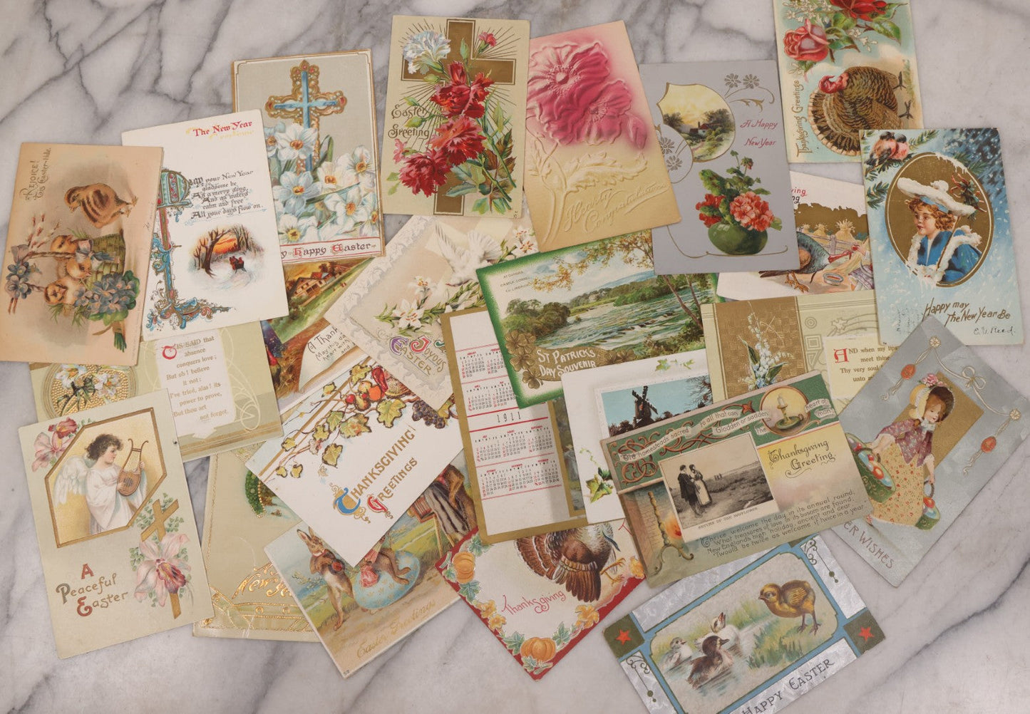 Lot 111 - Grouping Of 25 Antique Holiday Postcards, Most Embossed, Some With Glitter, Including New Years, Easter, Thanksgiving And More