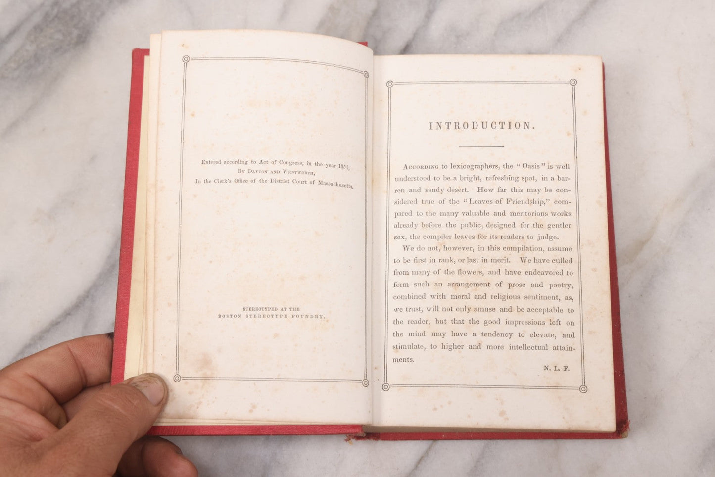 Lot 118 - "The Oasis" Antique Collected Poetry And Prose Book Edited By N.L. Ferguson With Illustrated Cover Page, Embossed Gold Lettering And Designs On Spine And Cover, Published By Dayton And Wentworth, Boston, 1855