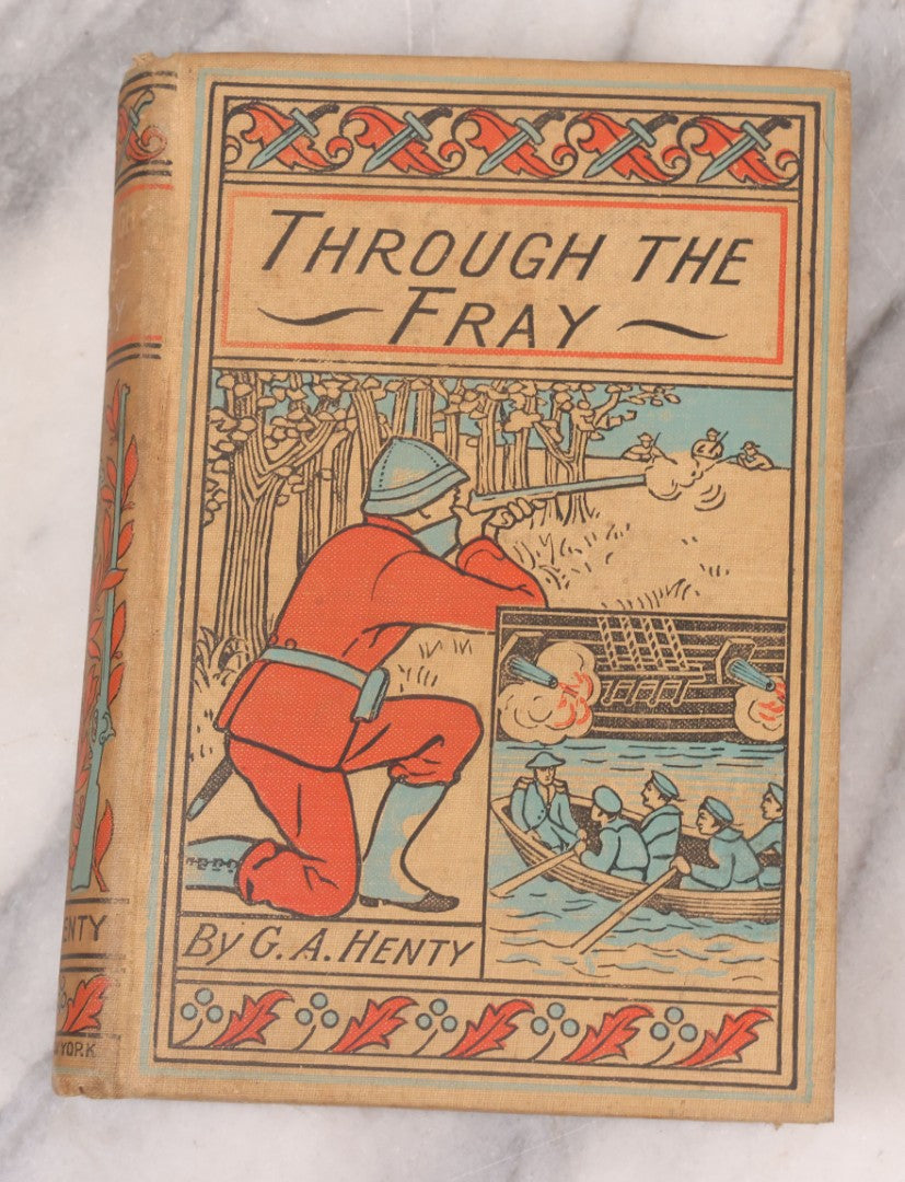 Lot 125 - "Through The Fray; A Tale Of The Luddite Riots" Antique Illustrated Novel By G.A. Henty, Cover And Spine Featuring Depictions Of Weapons And Battle Scenes, Published By A.L. Burt, New York, Circa 1900