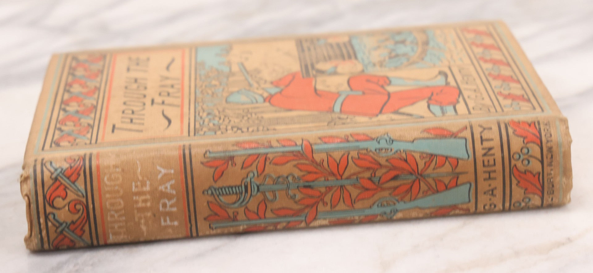 Lot 125 - "Through The Fray; A Tale Of The Luddite Riots" Antique Illustrated Novel By G.A. Henty, Cover And Spine Featuring Depictions Of Weapons And Battle Scenes, Published By A.L. Burt, New York, Circa 1900