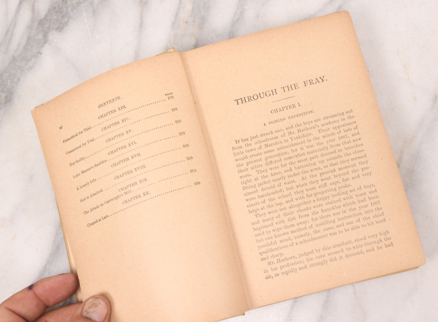 Lot 125 - "Through The Fray; A Tale Of The Luddite Riots" Antique Illustrated Novel By G.A. Henty, Cover And Spine Featuring Depictions Of Weapons And Battle Scenes, Published By A.L. Burt, New York, Circa 1900