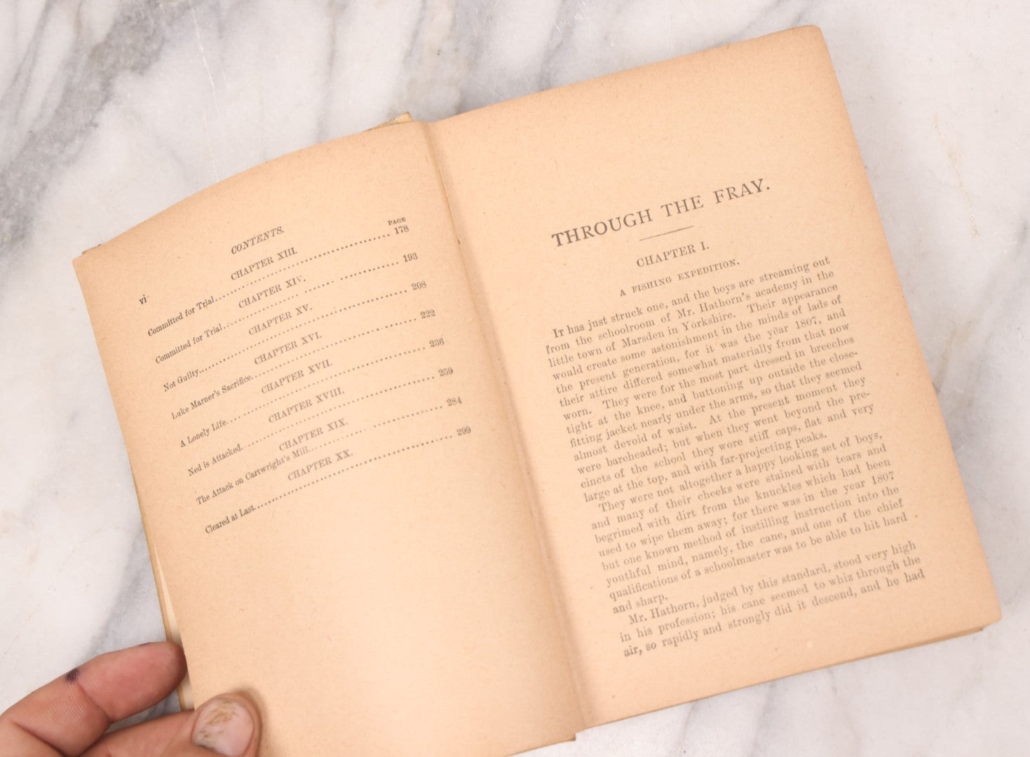 Lot 125 - "Through The Fray; A Tale Of The Luddite Riots" Antique Illustrated Novel By G.A. Henty, Cover And Spine Featuring Depictions Of Weapons And Battle Scenes, Published By A.L. Burt, New York, Circa 1900