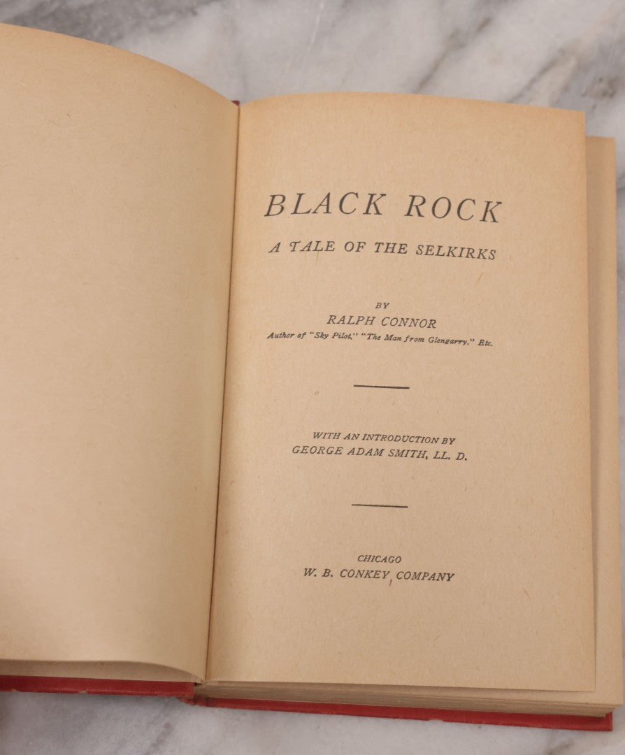 Lot 127 - "Black Rock; A Tale Of The Selkirks" Antique Novel By Ralph Connor, With Art Nouveau Design On Cover And Spine, Published By W.B. Conkey Company, Chicago, Circa 1900