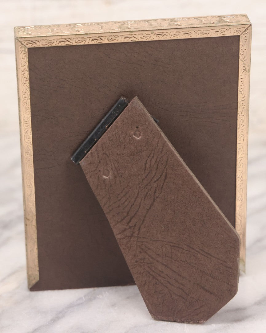 Lot 140 - Vintage Snapshot Photograph Of Curious Kitten In Driveway, With Car In Photo, In Vintage Metal Frame, Circa 1940s, 4-1/8" x 5-1/8"