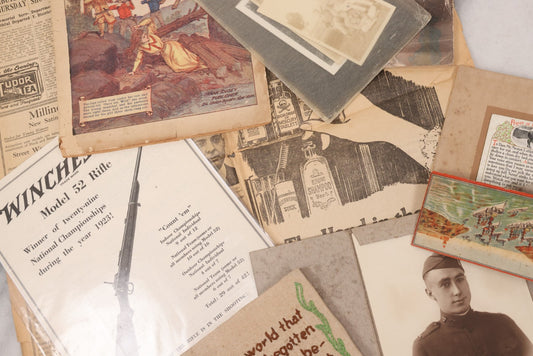 Lot 142 - Grouping Of Eight Piece Of Assorted Vintage And Antique Ephemera Including Photo Of Soldier, Snapshots, 1912 Wild West Magazine, Winchester Model 52 Rifle Advertisement, Embroidery, Prayer For The Horse, And More