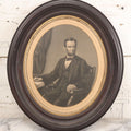 Lot 005 - Antique Engraving Print Of President Abraham Lincoln At Desk With Emancipation Proclamation, After George E. Perine, In Period Oval Frame With Original Glass And Wood Backing, Circa 1864, 14" x 16"