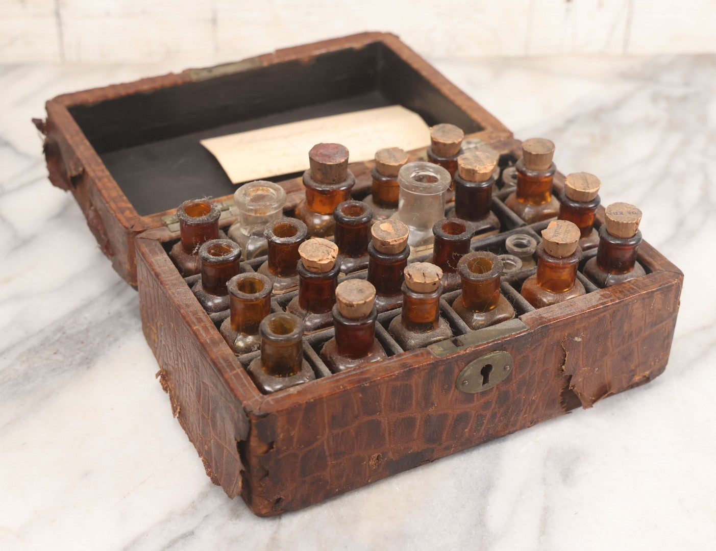 Lot 006 - Antique Traveling Apothecary Box Kit With Key, 24-Section Interior With 22 Bottles And 4 Smaller Bottles, Including Belladonna, Nux Vomica, Chamomilla, Arsenicum, And Tartarus Emeticus, Boericke & Tafel Homeopathic Pharmacy, New York & Chicago