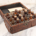 Lot 006 - Antique Traveling Apothecary Box Kit With Key, 24-Section Interior With 22 Bottles And 4 Smaller Bottles, Including Belladonna, Nux Vomica, Chamomilla, Arsenicum, And Tartarus Emeticus, Boericke & Tafel Homeopathic Pharmacy, New York & Chicago